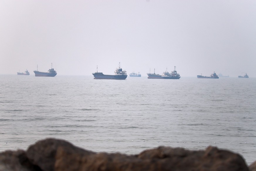 Commercial vessels are seen in the Strait of Hormuz off Bandar Abbas, Iran, Tuesday, June 30, 2026. (Amirhosein Khorgooi/ISNA via AP)