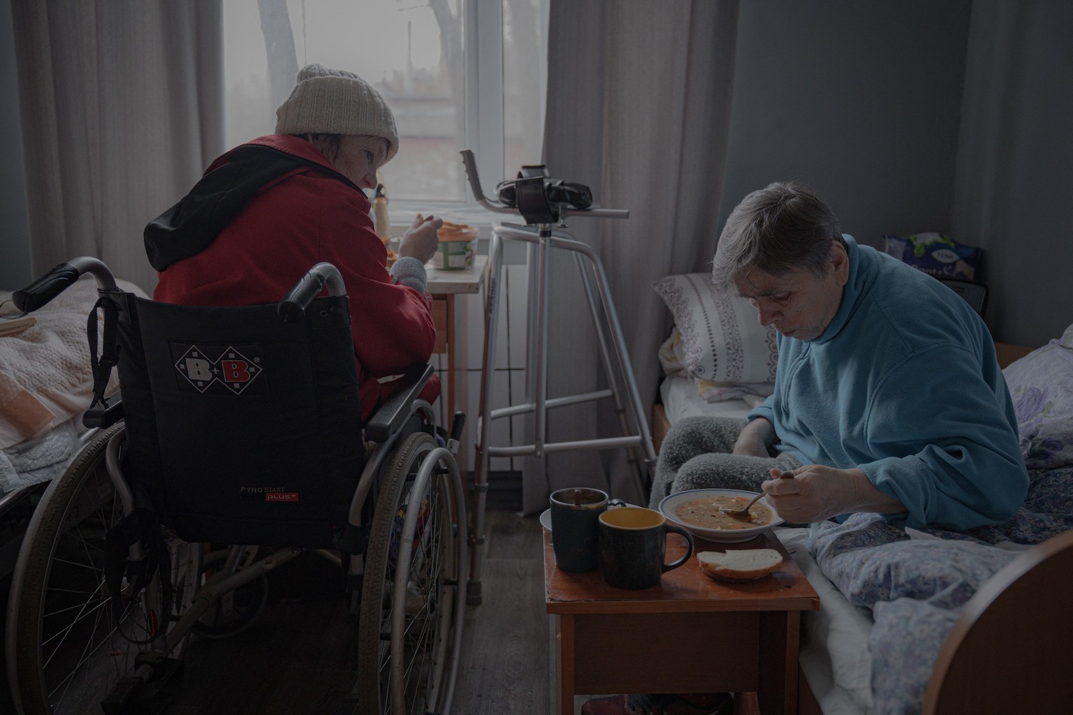 Two elderly women have lunch in their room at a shelter for senior citizens in Kharkiv on March 26, 2025, amid the Russian invasion of Ukraine. The war has disproportionately affected Ukraine&#039;s s ...
