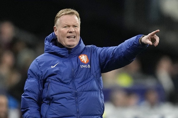 Netherlands&#039; head coach Ronald Koeman gives instructions from the side line during the Euro 2024 group B qualifying soccer match between France and the Netherlands at the Stade de France in Saint ...