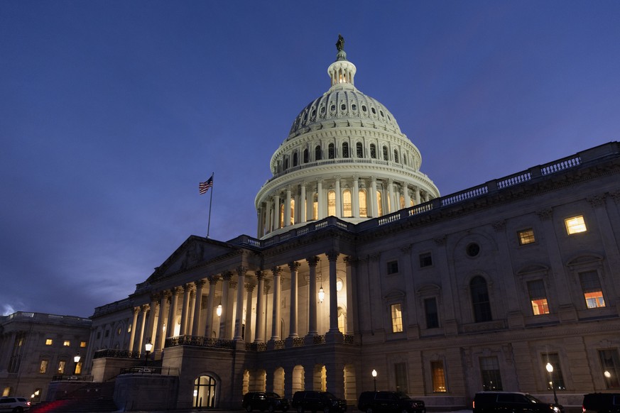 epa11083857 The US Capitol Building is seen at dusk before a Senate vote on Capitol Hill in Washington, DC, USA, 16 January 2024. The Senate is poised to vote whether to to advance a short-term govern ...