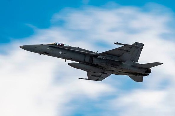 A Finnish F-18 Hornet takes part in joint exercises between the Finnish and the Swedish air forces over the Arctic Circle towns of Jokkmokk in Sweden and Rovaniemi in Finland on March 25, 2019. - The  ...