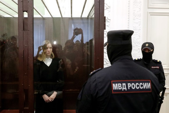 epa10976084 Daria Trepova (C, back) looks on as she attends an off-site court hearing at the First Western District Military court in St. Petersburg, Russia, 15 November 2023. Trepova, who was arreste ...