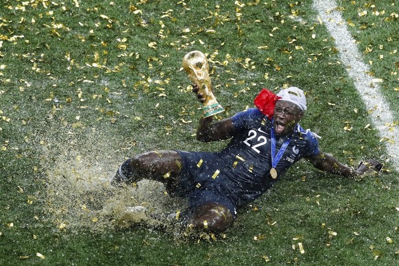 France&#039;s Benjamin Mendy celebrates with the trophy after the final match between France and Croatia at the 2018 soccer World Cup in the Luzhniki Stadium in Moscow, Russia, Sunday, July 15, 2018.  ...