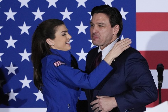 Republican presidential candidate Florida Gov. Ron DeSantis gets a hug from his wife Casey as he speaks to supporters during a caucus night party, Monday, Jan. 15, 2024, in West Des Moines, Iowa. (AP  ...