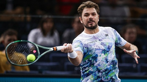 epa10949710 Stan Wawrinka of Switzerland in action against Dominic Thiem of Austria during their first round match at the Rolex Paris Masters tennis tournament in Paris, France, 30 October 2023. EPA/C ...