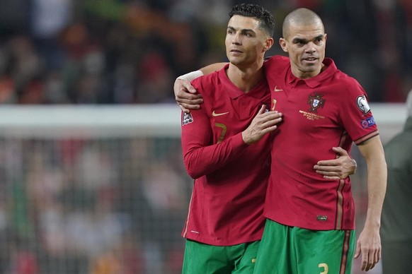 epa09859330 Portugal players Cristiano Ronaldo (L) and Pepe celebrate after the FIFA World Cup Qatar 2022 play-off qualifying soccer match Portugal vs North Macedonia held on Dragao stadium in Porto,  ...