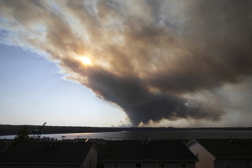 Thick plumes of heavy smoke fill the Halifax sky as an out-of-control fire in a suburban community quickly spread, engulfing multiple homes and forcing the evacuation of local residents, in Halifax, N ...