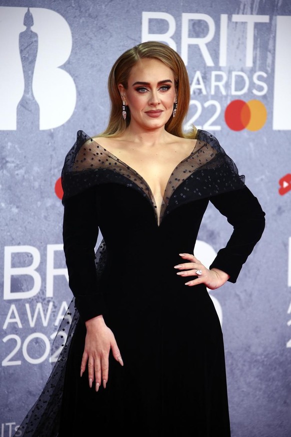 Adele poses for photographers upon arrival at the Brit Awards 2022 in London Tuesday, Feb. 8, 2022. (Photo by Joel C Ryan/Invision/AP)