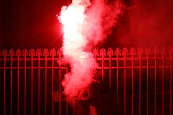 (FILES) A protester lights a flare during a rally called by the French ultra-right group &#039;Les Natifs&#039; at Place du Pantheon in Paris on December 1, 2023, to pay tribute to Thomas, a teenager  ...