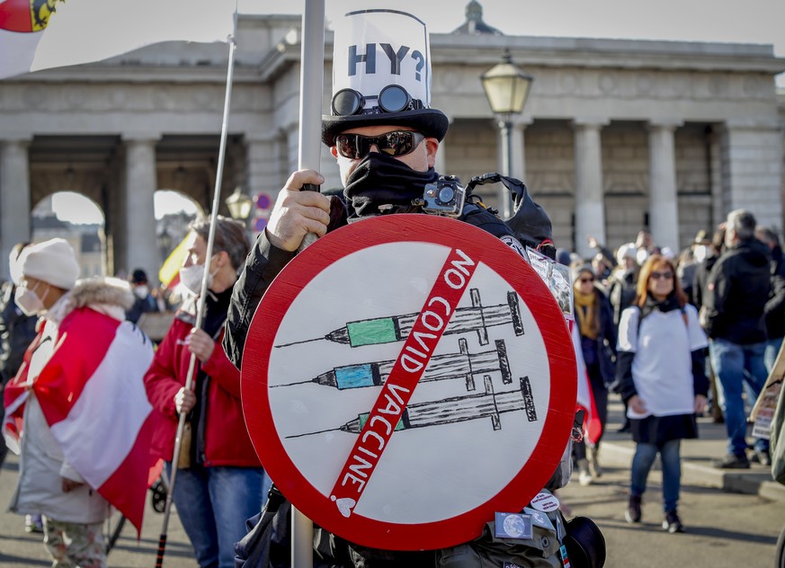 FILE - A man takes part in a demonstration against the country&#039;s coronavirus restrictions in Vienna, Austria, Nov. 20, 2021. Austria&#039;s parliament is due to vote Thursday, Jan. 20, 2022, on p ...