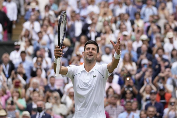 FILE - Serbia&#039;s Novak Djokovic celebrates toward the crowd after defeating Italy&#039;s Matteo Berrettini in the men&#039;s singles final on day thirteen of the Wimbledon Tennis Championships in  ...