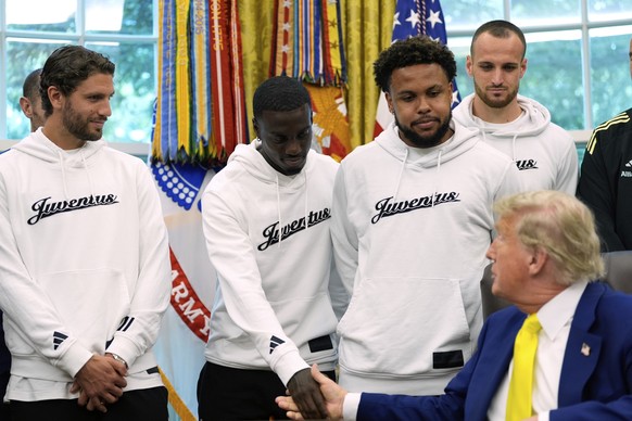 President Donald Trump meets with members of the Juventus soccer club in the Oval Office of the White House, Wednesday, June 18, 2025, in Washington. (AP Photo/Alex Brandon)