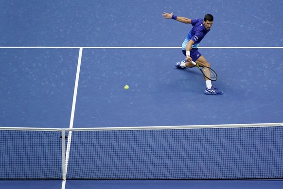 Novak Djokovic, of Serbia, returns a shot to Daniil Medvedev, of Russia, during the men&#039;s singles final of the US Open tennis championships, Sunday, Sept. 12, 2021, in New York. (AP Photo/Seth We ...