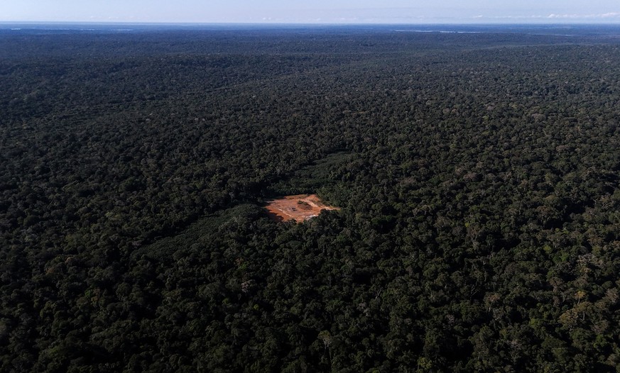 epa12200416 (FILE) - Aerial view shows a deforested area with a red-painted metal structure used to maintain pressure and control gas flow in the Amazon rainforest, Brazil, 14 June 2024 (reissued 27 J ...