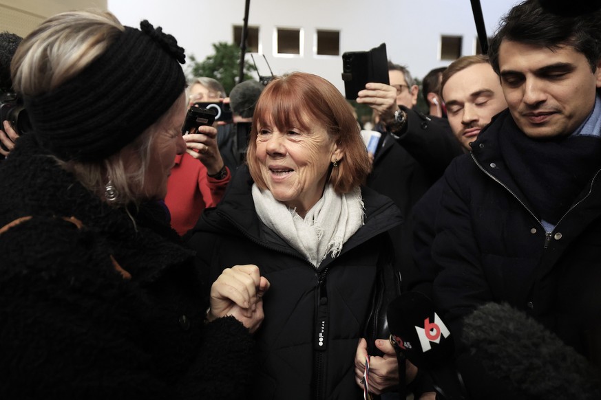 epa11780351 Gisele Pelicot (C), escorted by her lawyer Stephane Babonneau (R), leaves the criminal court where her ex-husband Dominique Pelicot stands trial, in Avignon, South of France, 16 December 2 ...