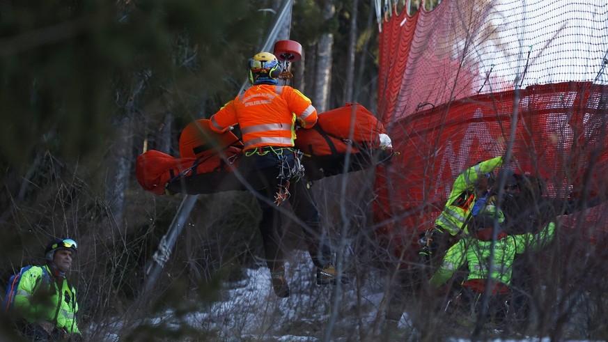 Medical staff are carrying France&#039;s Cyprien Sarrazin after crashing into protections net during an alpine ski, men&#039;s World Cup downhill training, in Bormio, Italy, Friday, Dec. 27, 2024. (AP ...