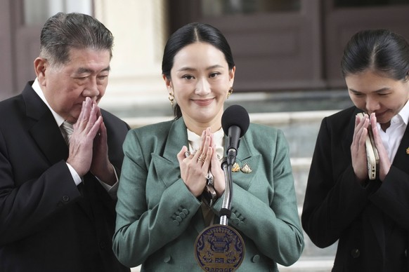 Thailand&#039;s Prime Minister Paetongtarn Shinawatra, center, speaks to media at the Government House in Bangkok, Thailand, Tuesday, July 1, 2025, (AP Photo/Sakchai Lalit)
Thailand Politics