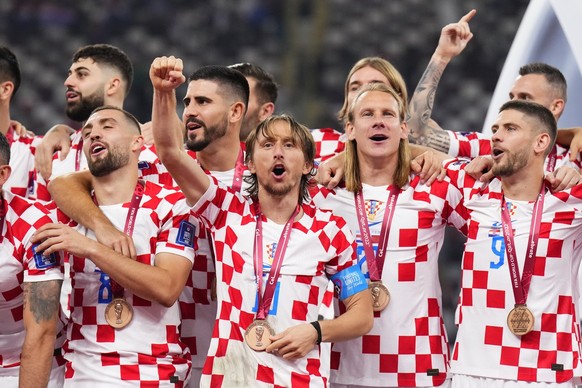 Croatia&#039;s players celebrate with their medals after the World Cup third-place playoff soccer match between Croatia and Morocco at Khalifa International Stadium in Doha, Qatar, Saturday, Dec. 17,  ...