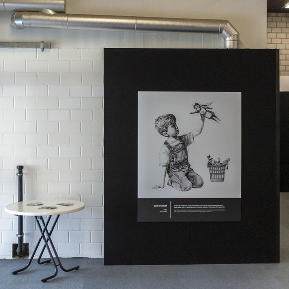 A facsimile of the artwork Game Changer (2020) by the artist known as Banksy is on display in the exhibition Building Castles in the Sky in Basel, Switzerland, on 1 March 2021. The artist created and  ...