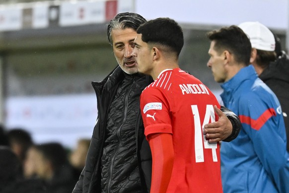 Switzerland&#039;s head coach Murat Yakin, left, with Zeki Amdouni during the UEFA Nations League group A2 soccer match between Switzerland and Czech Republic, on Tuesday, September 27, 2022, at the K ...