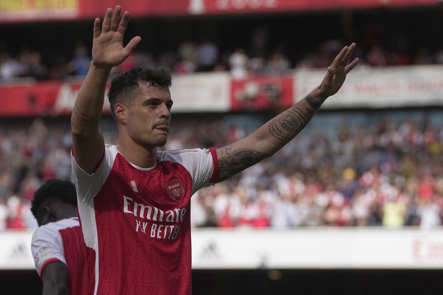 FILE - Arsenal&#039;s Granit Xhaka celebrates after scoring his side&#039;s opening goal during the English Premier League soccer match between Arsenal and Wolverhampton Wanderers at the Emirates Stad ...