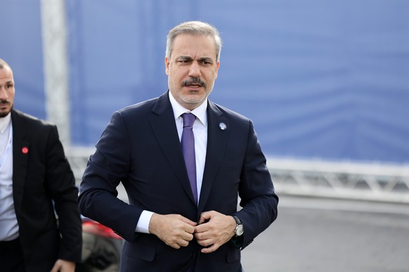 epa11758230 Turkey&#039;s Minister of Foreign Affairs, Hakan Fidan, arrives at the venue for the opening of the 31st Ministerial Council of the Organization for Security and Co-operation in Europe (OS ...
