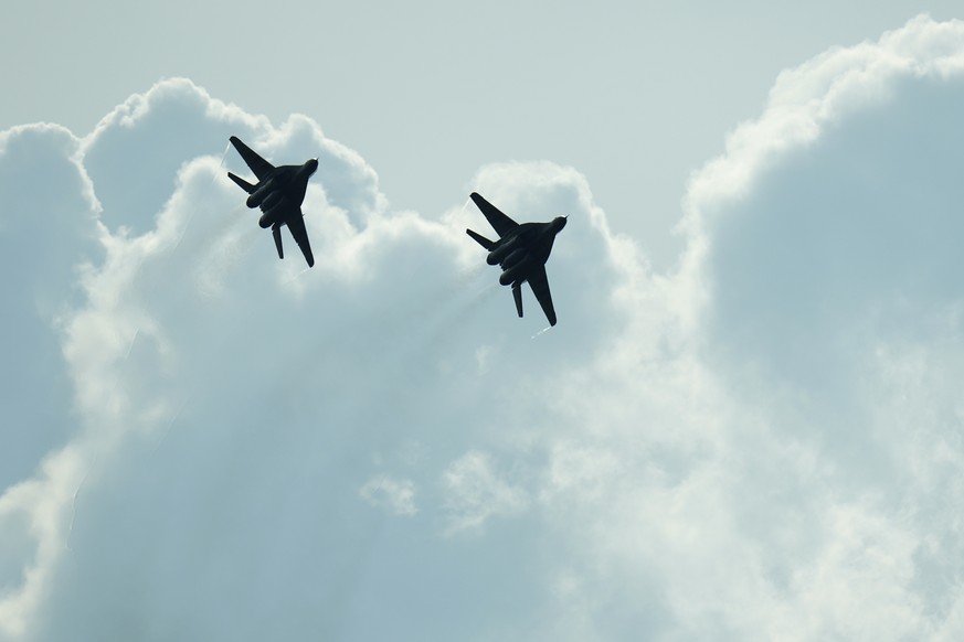 FILE - Slovak Air Force MiG-29s fly over an airport during an airshow in Malacky, Slovakia, Saturday, Aug. 27, 2022. On Friday March 17, 2023 Slovakia&#039;s government has approved a plan to give Ukr ...