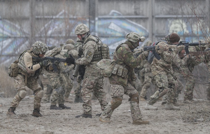 epa09649520 Ukrainian reservists attend a military exercise at a training ground near Kiev, Ukraine, 18 December 2021 (issued 19 December 2021). According to a survey conducted by the Kiev Internation ...