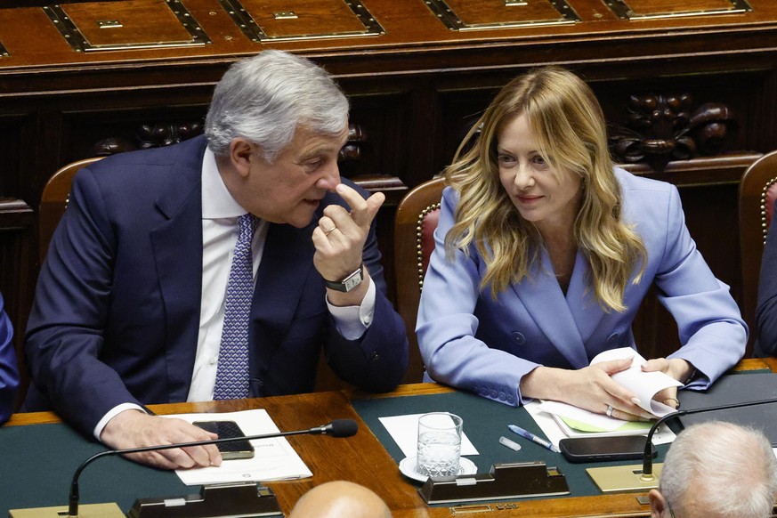 epa13029844 Italian Prime Minister Giorgia Meloni (R) speaks with Italian Foreign Minister and Deputy Prime Minister Antonio Tajani as she reports to the Chamber of Deputies on the upcoming European C ...