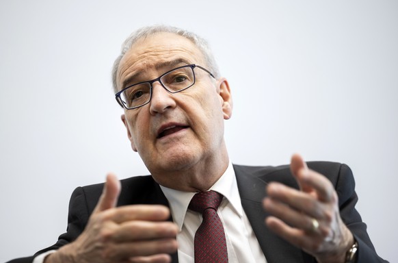 epa11434006 Swiss Federal Councillor and head of the Department of Economic Affairs, Education and Research, Guy Parmelin, speaks with a journalist during a ministerial meeting of the European Free Tr ...