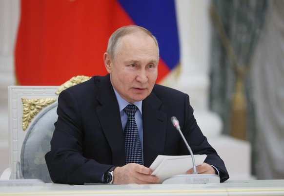 epa10457499 Russian President Vladimir Putin meets with representatives of the professional aviation community on the 100th anniversary of domestic civil aviation, in Moscow, Russia, 09 February 2023. ...