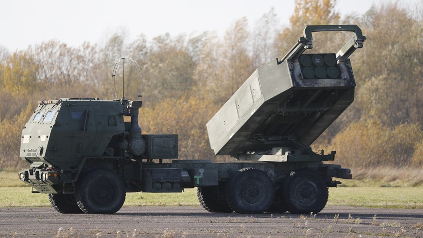 epa09545432 A view of a US High Mobility Artillery Rocket System (HIMARS) during a landing exercise at Spilva airfield in Riga, Latvia, 25 October 2021. The US Air Force special operation aircraft MC- ...