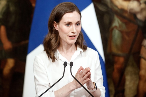 epa09954942 Finnish Prime Minister Sanna Marin and Italian Prime Minister Draghi (not pictured) attend a joint press conference following their meeting at Chigi Palace in Rome, Italy, 18 May 2022. The ...