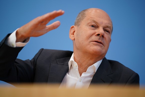 epa10115323 German Chancellor Olaf Scholz gestures during the beginning of a press conference at the Federal Press Conference (Bundespressekonferenz) in Berlin, Germany, 11 August 2022. The traditiona ...