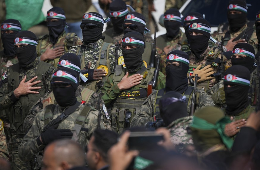 FILE - Hamas fighters stand in formation ahead of a ceremony to hand over Israeli hostages to the Red Cross in Nuseirat, Gaza Strip, Feb. 22, 2025. (AP Photo/Abdel Kareem Hana, File)
Palestinians Poli ...