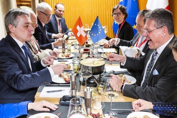 epa11844421 European Commissioner for Trade and Economic Security Maros Sefcovic (R) and Swiss Foreign Minister Ignazio Cassis (L) have lunch ahead of a bilateral meeting on the sidelines of the 55th  ...