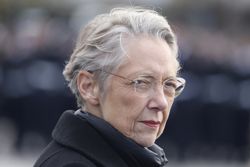 FILE - French Prime Minister Elisabeth Borne looks on as she attends a ceremony at the Arc de Triomphe, as part of the commemorations marking the105th anniversary of the Nov. 11, 1918 Armistice, endin ...