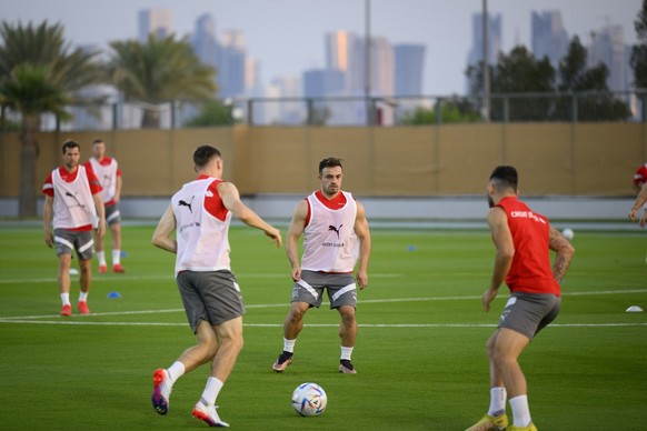 Switzerland&#039;s midfielder Xherdan Shaqiri, center, attends a open training session of Swiss national team in preparation for the FIFA World Cup Qatar 2022 at the University of Doha for Science and ...