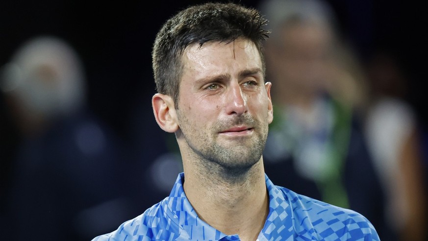 Novak Djokovic of Serbia cries after defeating Stefanos Tsitsipas of Greece in the men&#039;s singles final at the Australian Open tennis championships in Melbourne, Australia, Sunday, Jan. 29, 2023.  ...