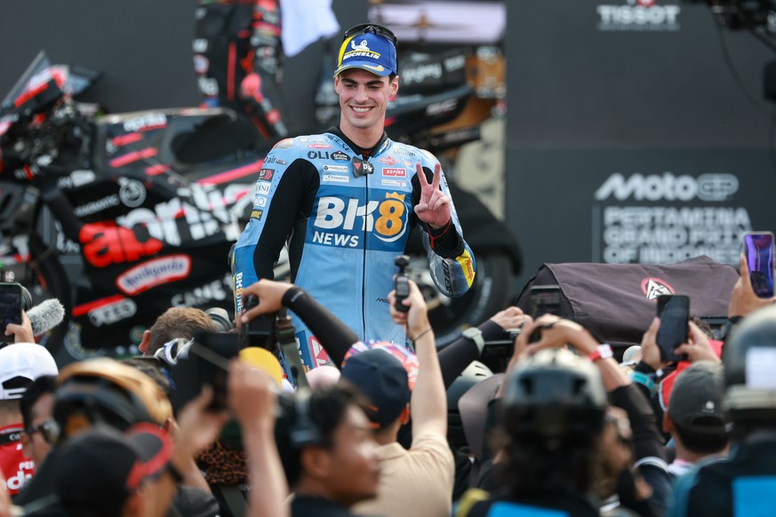 epa12429332 MotoGP Sprint Race second placed winner Gresini Racing MotoGP rider Fermin Aldeguer of Spain celebrates at the Motorcycling Grand Prix of Indonesia at Mandalika Circuit in Mandalika, Indon ...