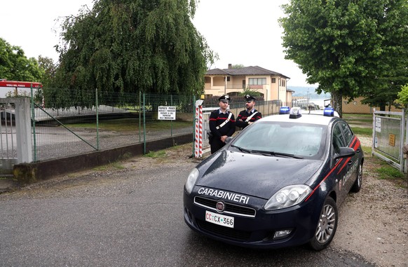 epa10661575 Italian Carabinieri officers stand guard at an entrance to the marina of Lake Maggiore, in the Lisanza district of Sesto Calende, in the province of Varese, northern Italy, 29 May 2023. Th ...