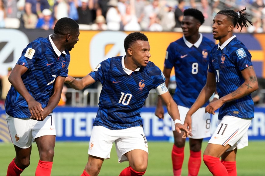 France's Kylian Mbappe, second right, celebrates with his teammates after scoring his side's opening goal during the World Cup round of 32 soccer match between France and Sweden in East Ruth ...