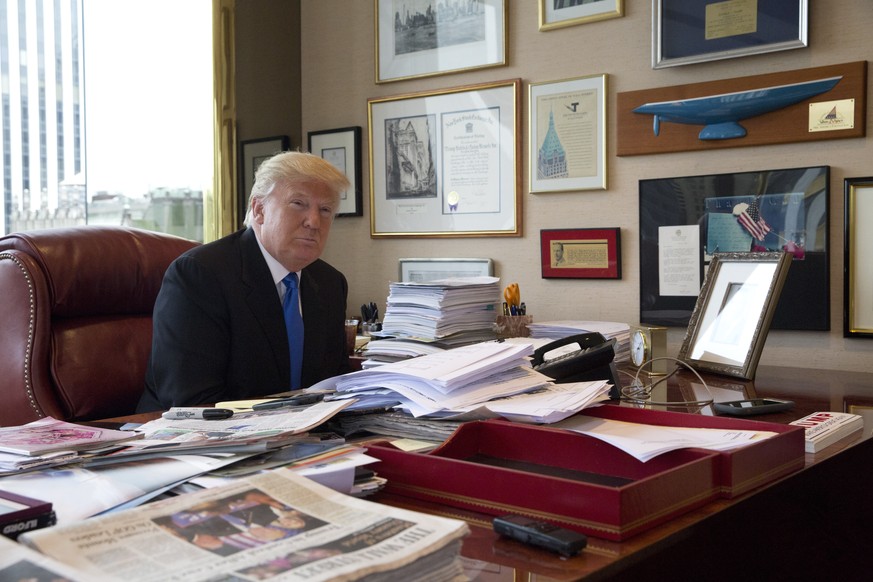 FILE - Then-Republican presidential candidate Donald Trump is photographed during an interview with The Associated Press in his office at Trump Tower in New York, May 10, 2016. The legal investigation ...