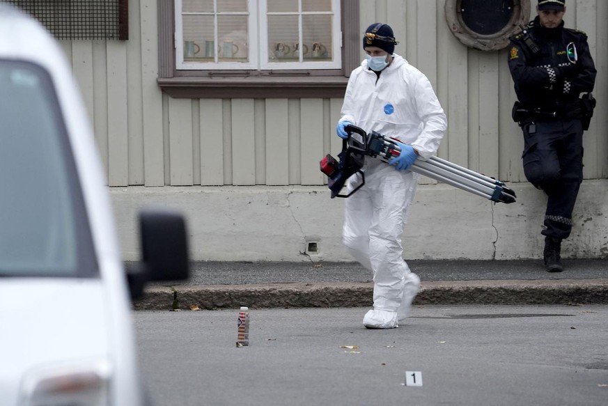 Police work near a site after a man killed some people in Kongsberg, Norway, Thursday, Oct. 14, 2021. A man armed with a bow and arrows killed several people Wednesday near the Norwegian capital of Os ...