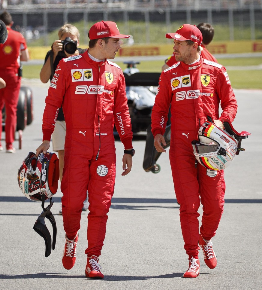 epa07635925 German Formula One driver Sebastian Vettel of Scuderia Ferrari (R) and Monaco&#039;s Formula One driver Charles Leclerc of Scuderia Ferrari (L) walk through the track after the qualifying  ...