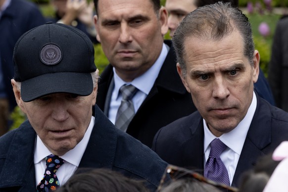 epa11254820 US President Joe Biden (L) and his son Hunter Biden (R) attend the 2024 Easter Egg Roll on the South Lawn of the White House in Washington, DC, USA, 01 April 2024. About forty thousand peo ...