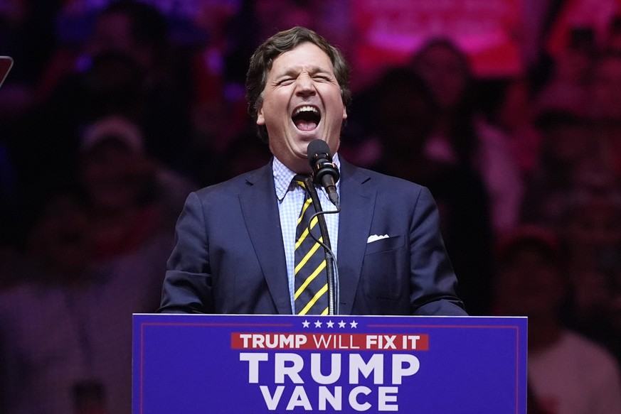 Tucker Carlson speaks before Republican presidential nominee former President Donald Trump at a campaign rally at Madison Square Garden, Sunday, Oct. 27, 2024, in New York. (AP Photo/Evan Vucci)