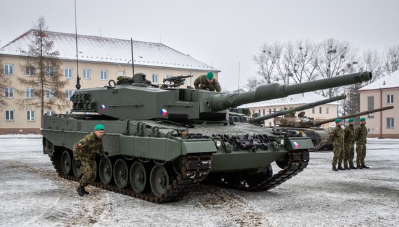 epa10375556 A Leopard 2A4 tank during a ceremony for the hand over of the symbolic key of the tank to the Czech army, in Praslavice, Czech Republic, 21 December 2022. The Czech Republic is to receive  ...