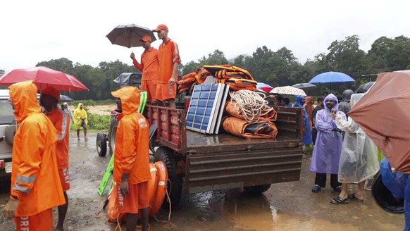 This photograph provided by National Disaster Response Force (NDRF) shows rescuers at a spot after a landslide in Wayanad, southern Kerala state, India, Tuesday, July 30, 2024. (NDRF via AP)