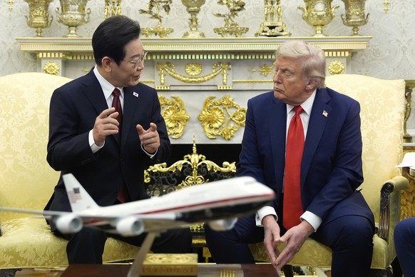 FILE - South Korean President Lee Jae Myung speaks as President Donald Trump listens during a meeting in the Oval Office of the White House, Monday, Aug. 25, 2025, in Washington. (AP Photo/Alex Brando ...